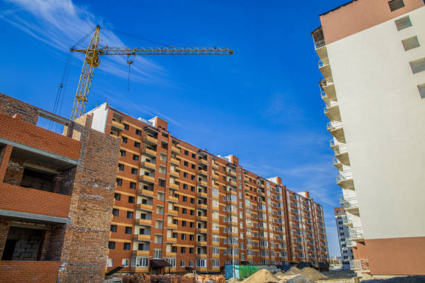 istock apartment building construction by crane brick exterior facade architecture shape urban industrial scene view 1224004289
