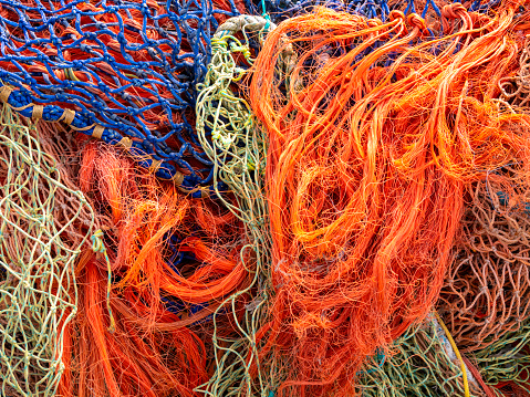 A tangle of colourful ropes and fishing nets seen in Harwich, Essex, Eastern England.