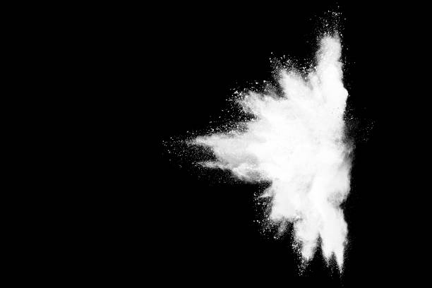 istock Freeze motion of white color powder exploding on dark background. 1224008261