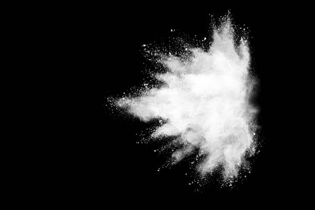 istock Freeze motion of white color powder exploding on dark background. 1224008284