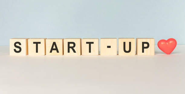 istock concept word on wooden cube on white background - Start up 1224008331