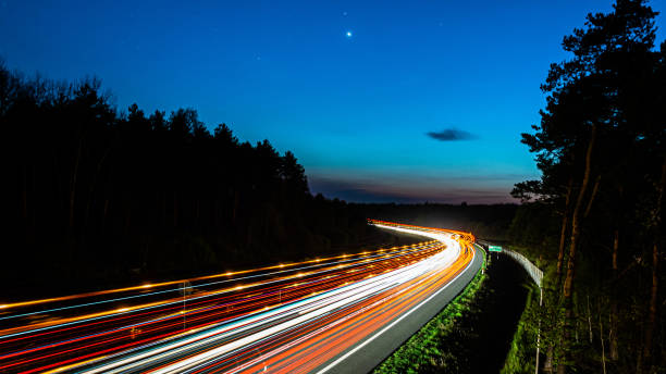 istock lights of cars with night 1224009306