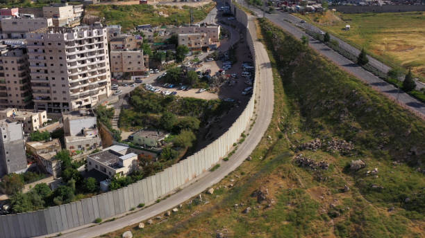 istock Shuafat Refugees Camp With Security Wall - Aerial 1224009726