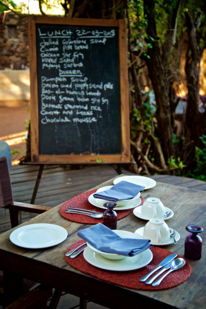 istock Morning Breakfast Menu On Board With Table Silverware In Grumeti River 1224009773