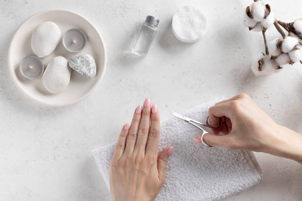 istock young woman cutting nails with manicure scissors. hygiene concept. 1224010793