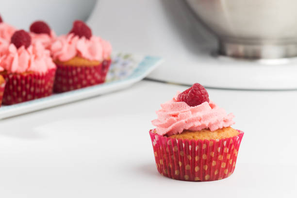 Birthday cupcake with butter cream on colorful background