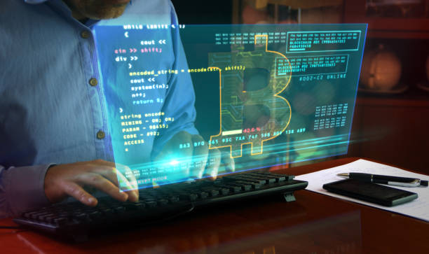 istock Bitcoin with typing on keyboard and cryptocurrency mining hologram screen 1224016378