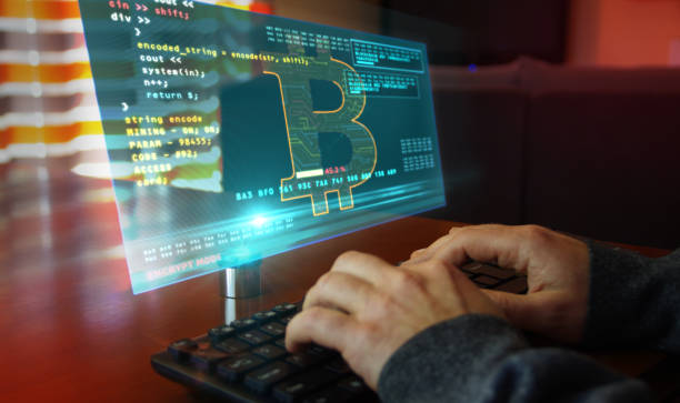 istock Bitcoin with typing on keyboard and cryptocurrency mining hologram screen 1224016405