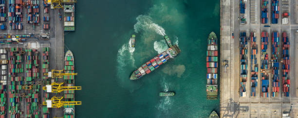 istock Container , container ship in export and import business and logistics. Shipping cargo to harbor by crane. Water transport International. Aerial view and top view. 1224018601
