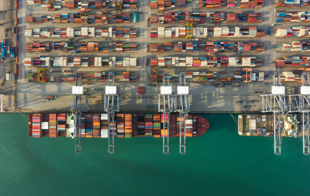 istock Container , container ship in export and import business and logistics. Shipping cargo to harbor by crane. Water transport International. Aerial view and top view. 1224018634