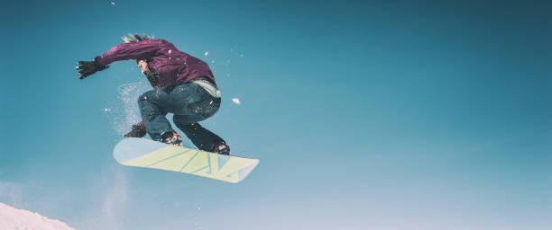 istock Freerider snowboarder doing speed trick air jump with his snowboard 1224019369