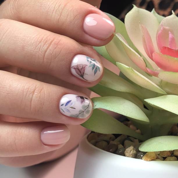 istock manicure and floral design on women's nails. 1224021071