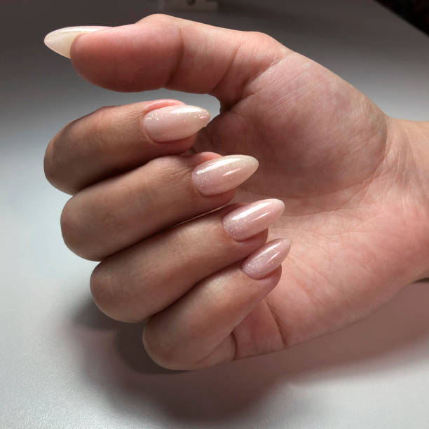 istock Solid manicure on girl nails with gel polish 1224021121