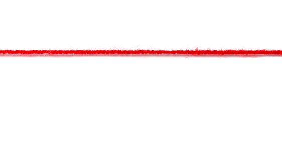 Red woolen thread stretched on a white background