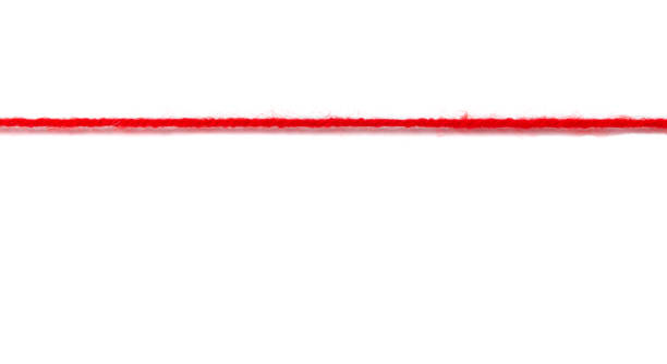 fio de lã vermelha grossa em um fundo branco. nervos para o conceito limite - sewing sewing item thread equipment - fotografias e filmes do acervo