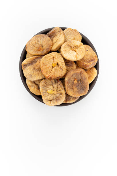 istock Dried apricots in round bowl on white background, top view 1224027057