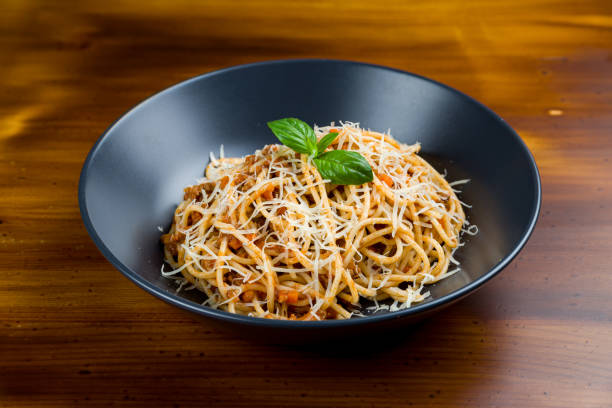 istock Pasta spaghetti Bolognese on black plate 1224027061
