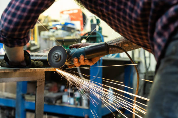 istock Crop man cutting metal in professional workshop 1224030389