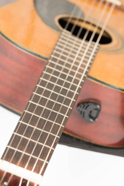 istock Acoustic guitar neck with frets with blurred background 1224030397