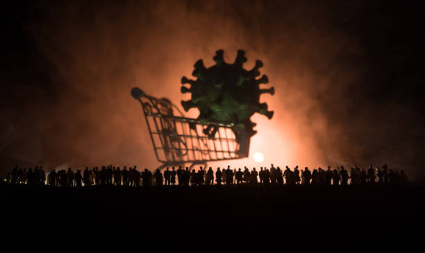 istock Coronavirus 2019-nCov novel coronavirus concept. Crowd looking on big Corona virus model at night with fog and backlight. Creative artwork decoration. Selective focus. 1224031132