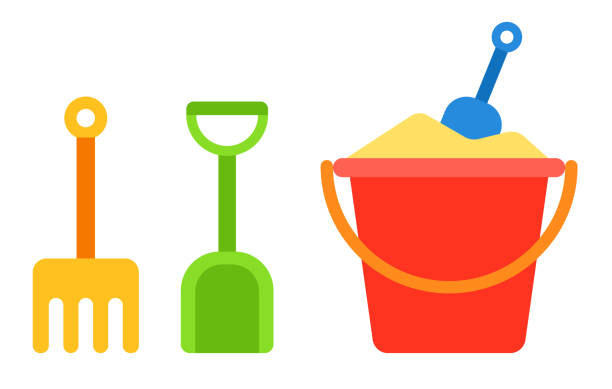 Set of kids sand bucket, shovel and rake vector icon flat isolated Red baby bucket with sand and shovel and rake for a sandbox next to it vertically vector flat icon isolated on white sand pail and shovel stock illustrations