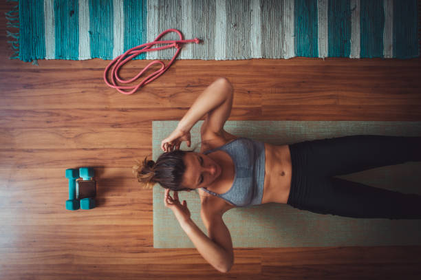 istock Sit-ups home workout online video call session 1224031590
