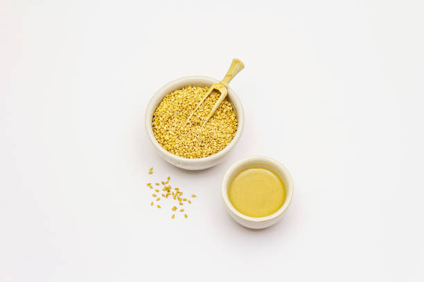 istock Hummus isolated on white background. Dry chickpea in wooden barrel 1224032685