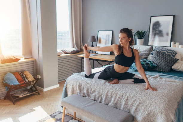 istock Fit woman doing exercise on bed at home 1224032928