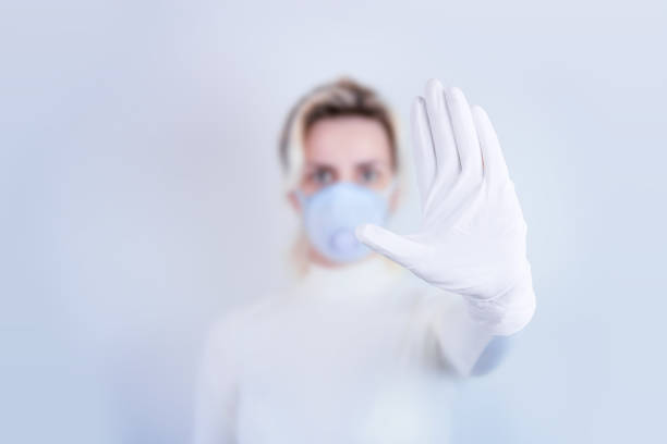 istock Young Medical Worker Showing Stop Gesture 1224035142