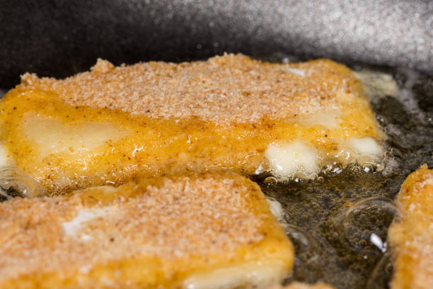istock Frying fried yellow cheese with eggs in frying pan 1224036167