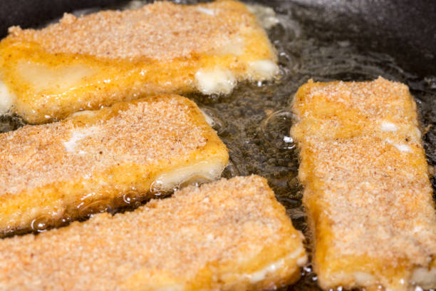 istock Frying fried yellow cheese with eggs in frying pan 1224036239