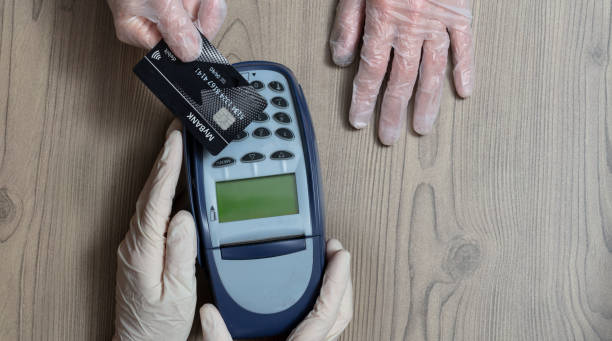 istock Shopper making a contactless payment at a shop 1224038924