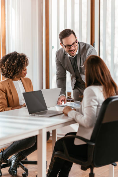 istock Three business people having meeting at the boardroom 1224040110