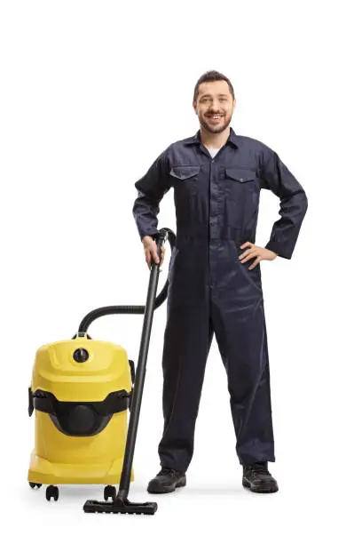 Photo of Male janitor with a professional hoover