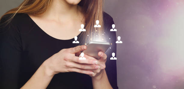 istock Worldwide connection technologies. Millennial girl surfing internet on smartphone, collage with global network icons 1224041038