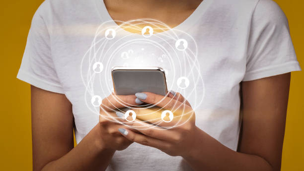 istock Global connections. Young woman using web on mobile phone, collage with worldwide network icons, close up. Panorama 1224041081