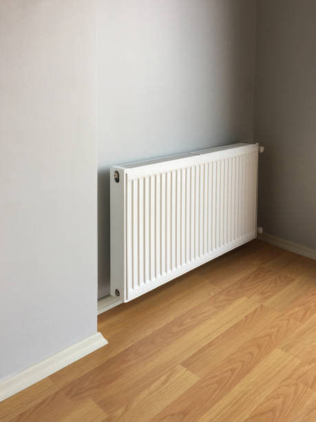 istock New modern home radiator with clean wall and parquet flooring 1224041178