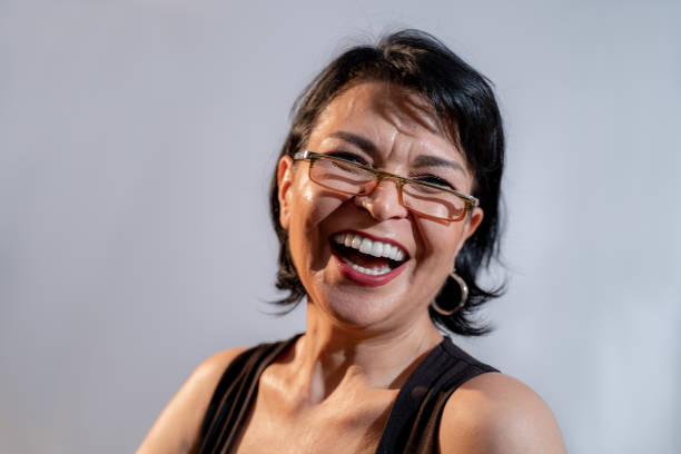 istock Happy senior woman laughs camera white background 1224043703