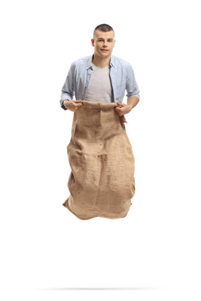 istock Young man jumping in a sack playing gunny race 1224043849