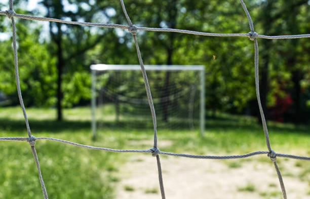 istock White goal post in a children soccer field 1224044407