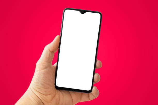 istock person holding smart phone in hand with white blank screen and red background 1224044586
