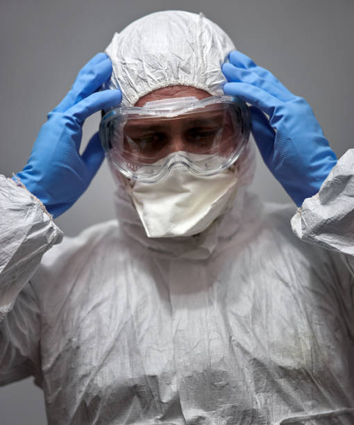 istock Overwhelmed man in hazard overall suit 1224044904