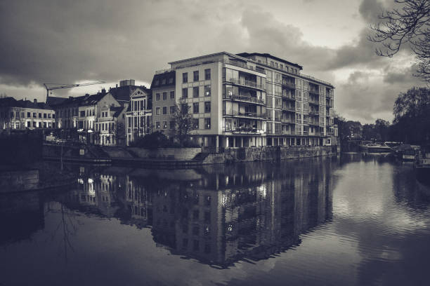 Mirrored house in water in black and white