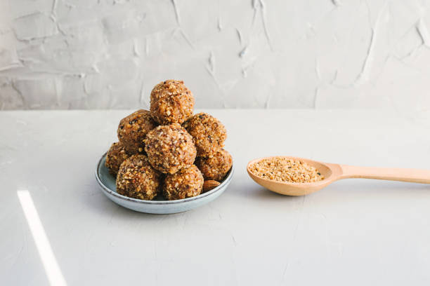 istock Energy balls in a plate on a grey background. 1224048837