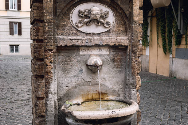 An ancient antique drinking fountain in Rome, Italy
