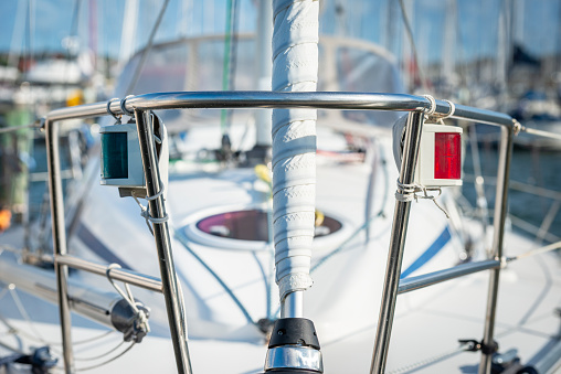 Sailing crew on sailboat during regatta. All model and regatta property released.