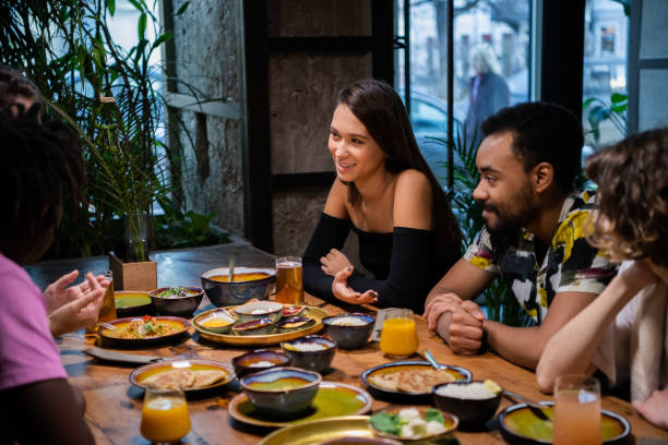 istock Young multi-ethnic friends celebrating something in a cafe 1224053237