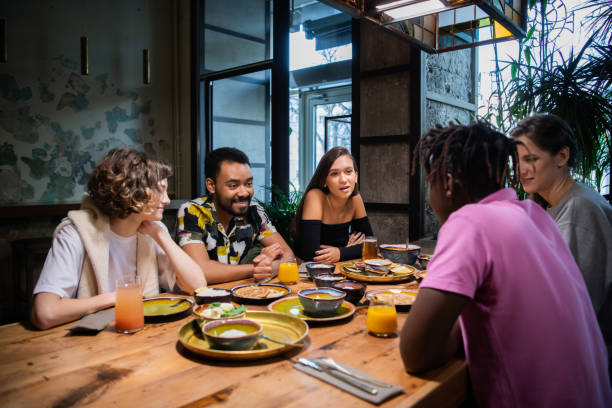 istock Highschool students having a lunch in a modern cafe 1224053258