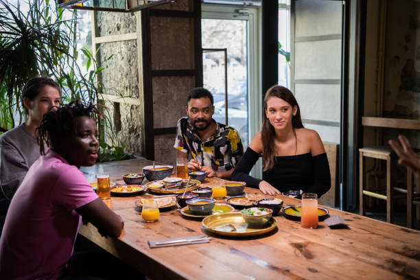 istock A multicultural group of friends spending time in a cafe, everyo 1224053277