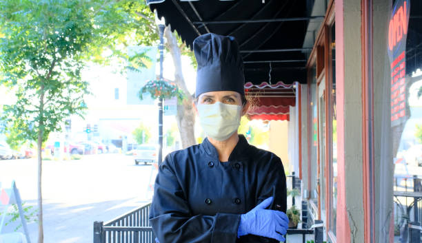 istock Chef fast food restaurant owner posing wearing a mask and protective gloves 1224054104